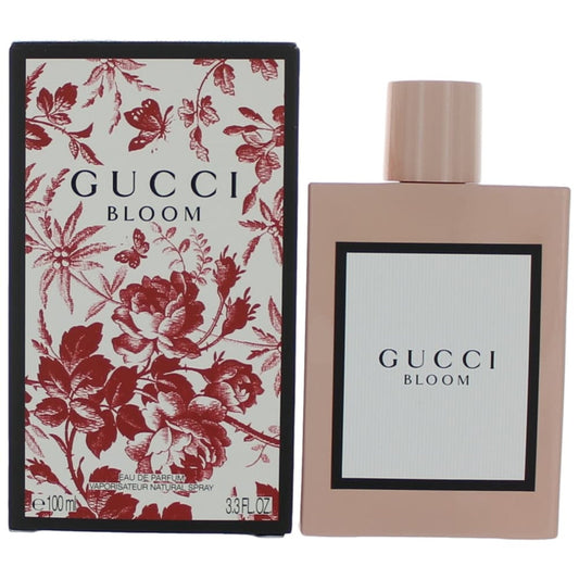 Botella de perfume Gucci Bloom de 3.4 oz para mujer, con un diseño cuadrado de color rosa pálido.