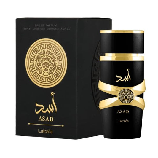 Botella de perfume Lattafa Asad para hombre de 3.4 oz, con un diseño cilíndrico y un color dorado metálico.