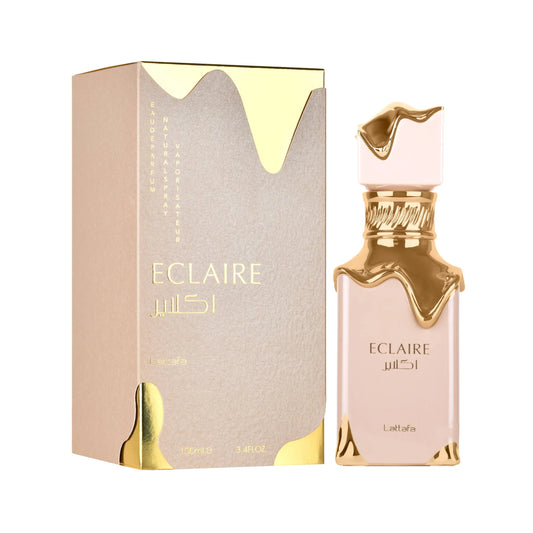 Botella de perfume Lattafa Eclaire de 3.4 oz, con un diseño de vidrio transparente y tapa dorada.
