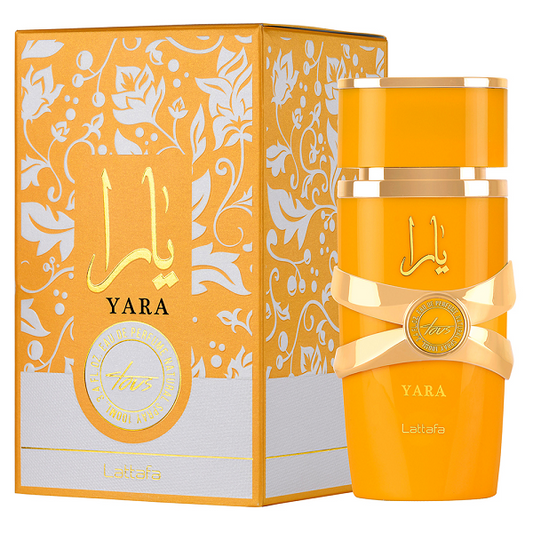 Botella de perfume Lattafa Yara Tous para mujer de 3.4 oz, con un diseño cilíndrico de color dorado y tapa en forma de corona.